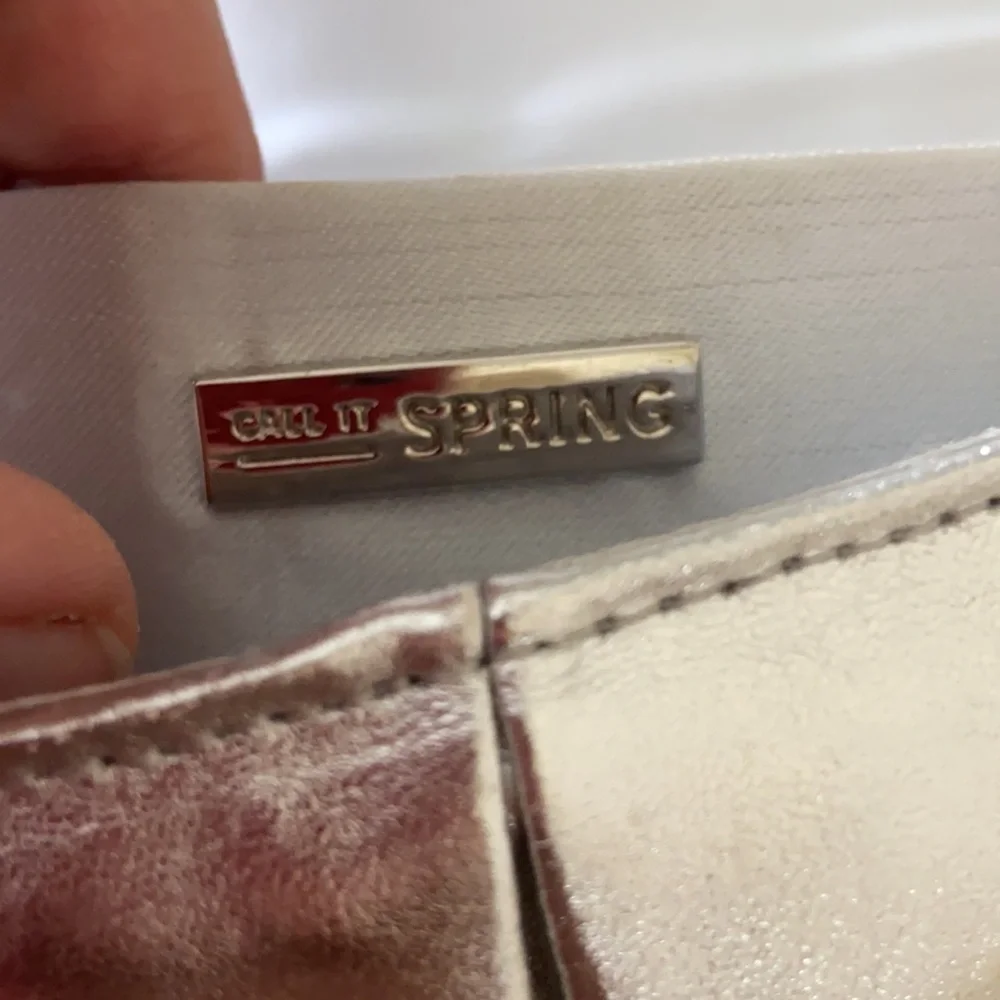 Silver clutch with removable chain and wrist strap